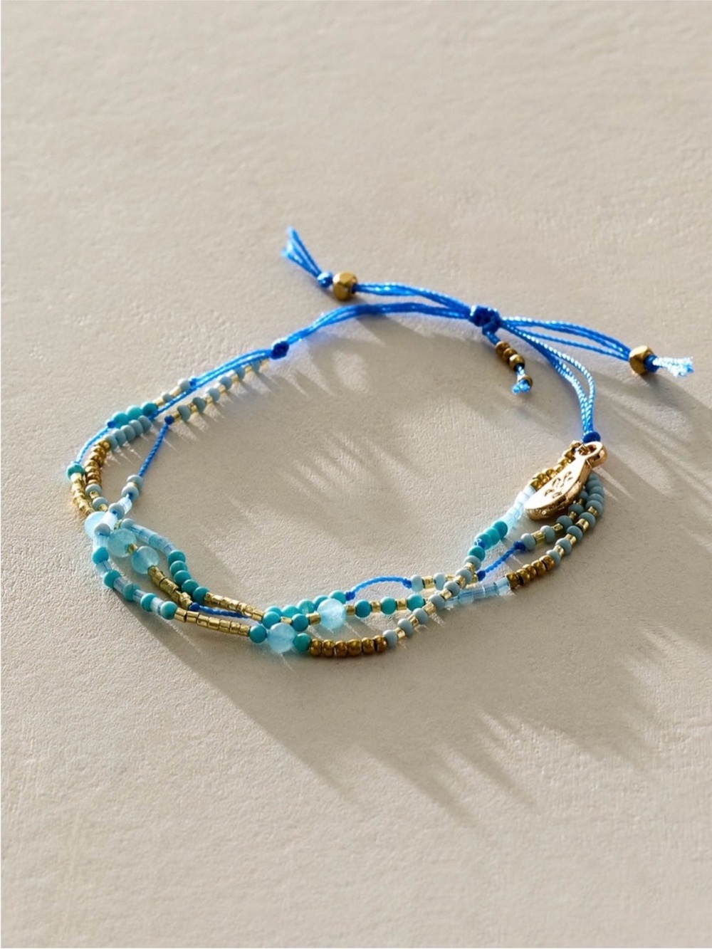 Free People Cove collective Blue and Gold Beaded Multi-Strand Bracelet